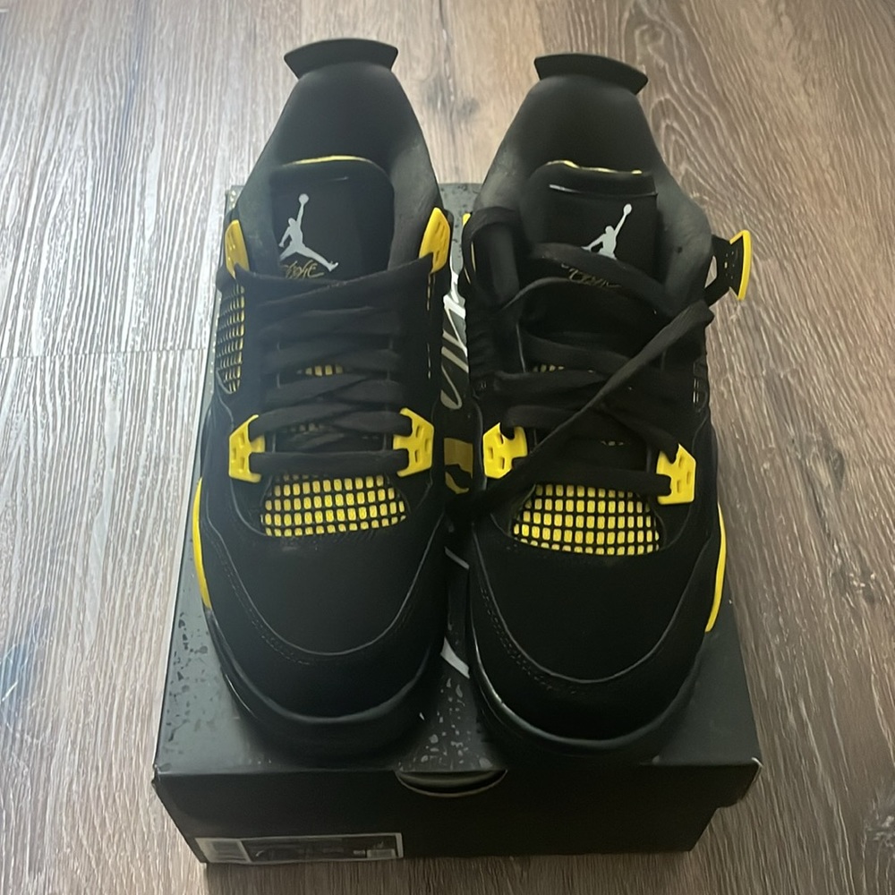 Black, white and yellow Air Jordan 4